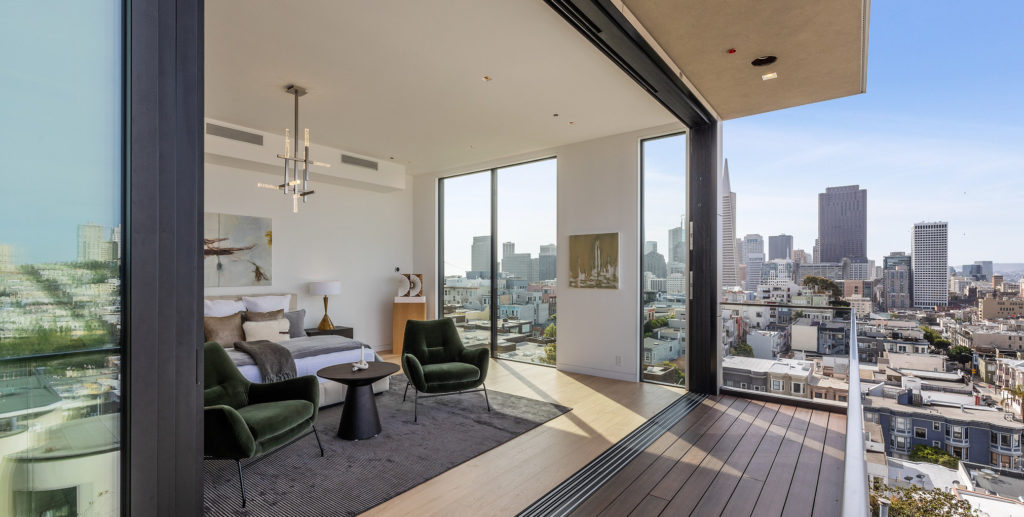NYC Apartment with sliding glass door leading to balcony.